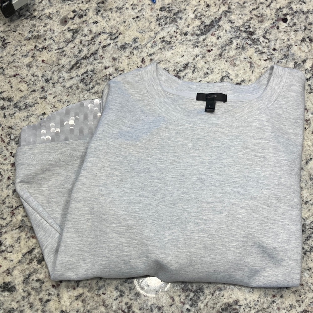 Jcrew grey sweater with layered detail at the bottom